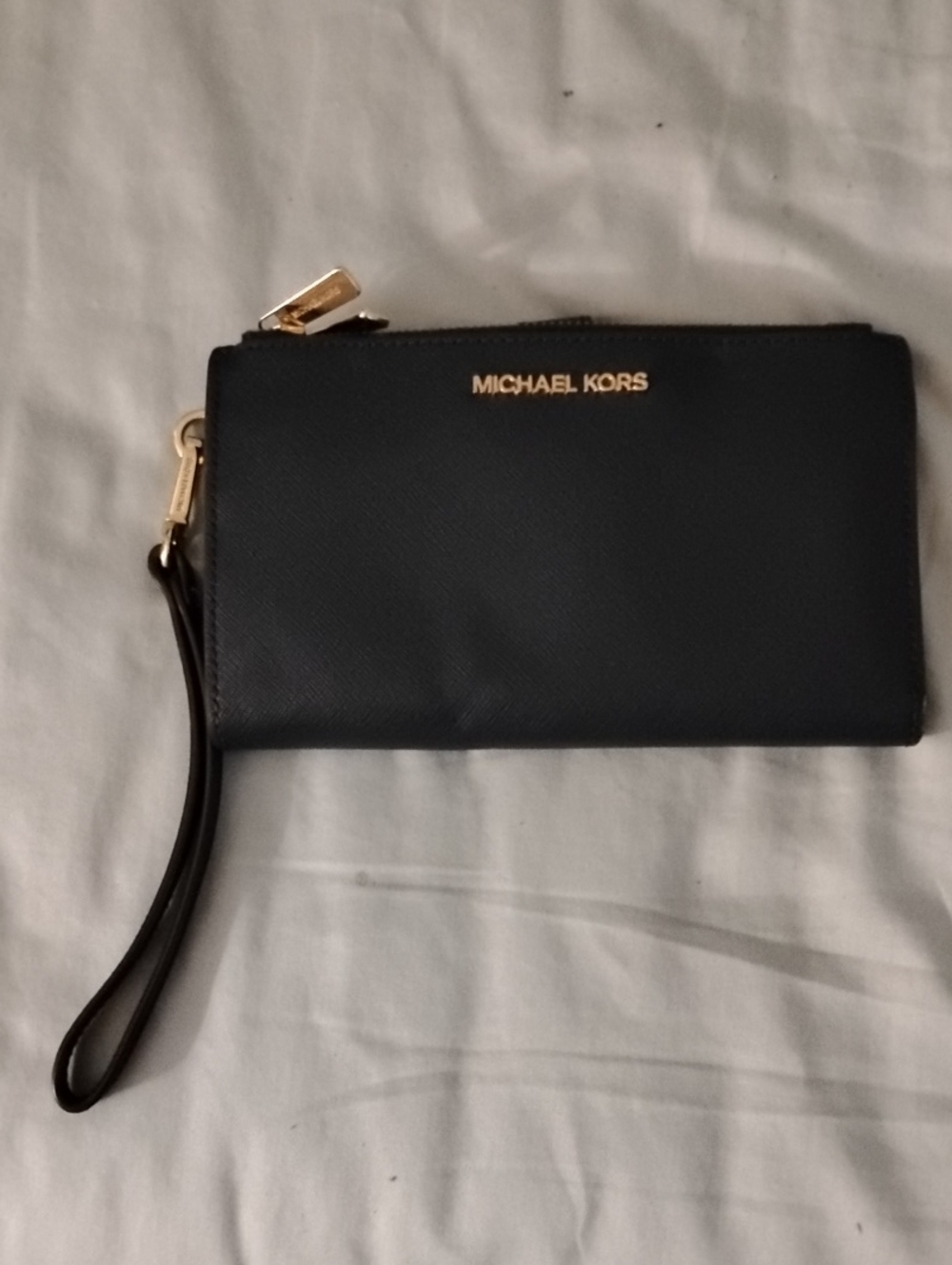 Michael Kors navy blue wristlet 7.5x 4.5 inches